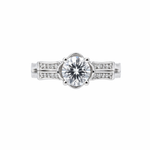 Elegant solitaire ring with sparkling side accents.