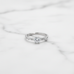Elegant solitaire ring with delicate twisted band.