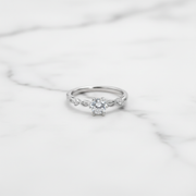 Elegant solitaire ring with delicate twisted band.