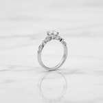 Elegant solitaire ring with delicate twisted band.