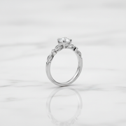 Elegant solitaire ring with delicate twisted band.