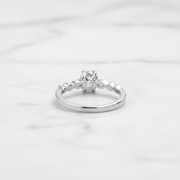Elegant solitaire ring with delicate twisted band.