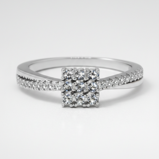 Elegant square cluster diamond ring with a delicate sparkling band.