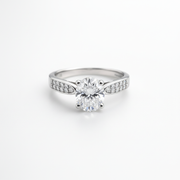 A timeless solitaire ring with a brilliant center stone and shimmering side accents