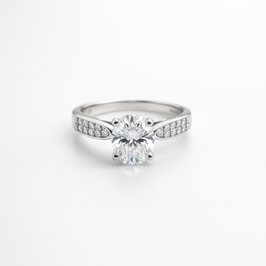 A timeless solitaire ring with a brilliant center stone and shimmering side accents