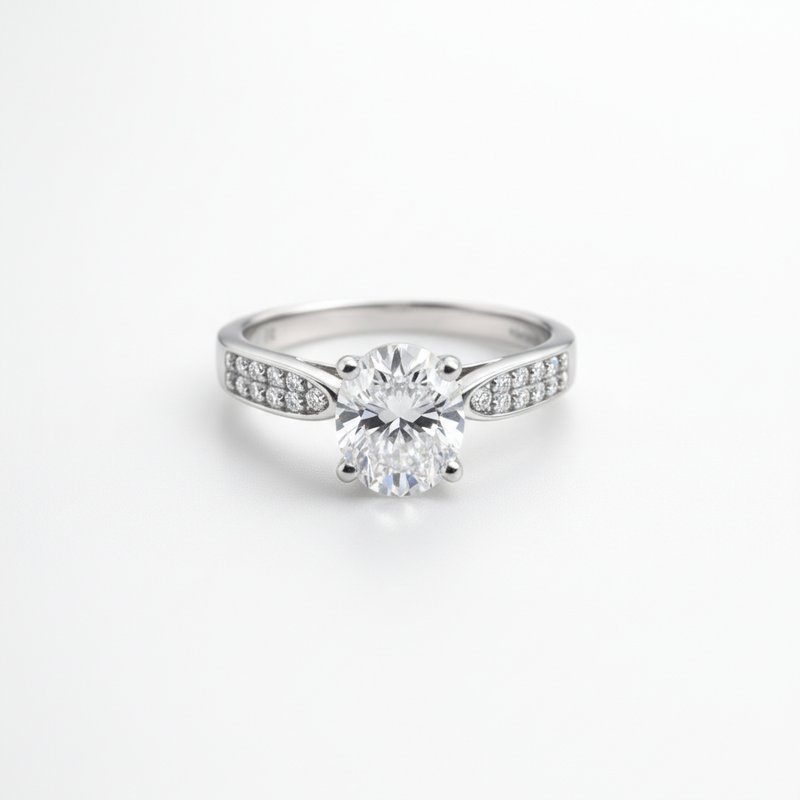 A timeless solitaire ring with a brilliant center stone and shimmering side accents