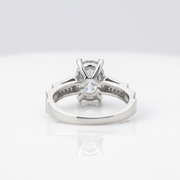 Elegant solitaire ring with sparkling side accents.