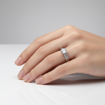 Elegant solitaire ring with sparkling side accents.