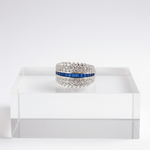 Elegant diamond band with sapphire centerpiece