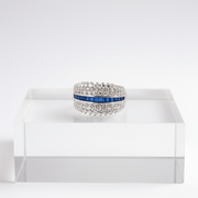 Elegant diamond band with sapphire centerpiece