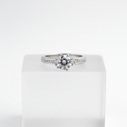 Elegant solitaire ring with sparkling side stones.