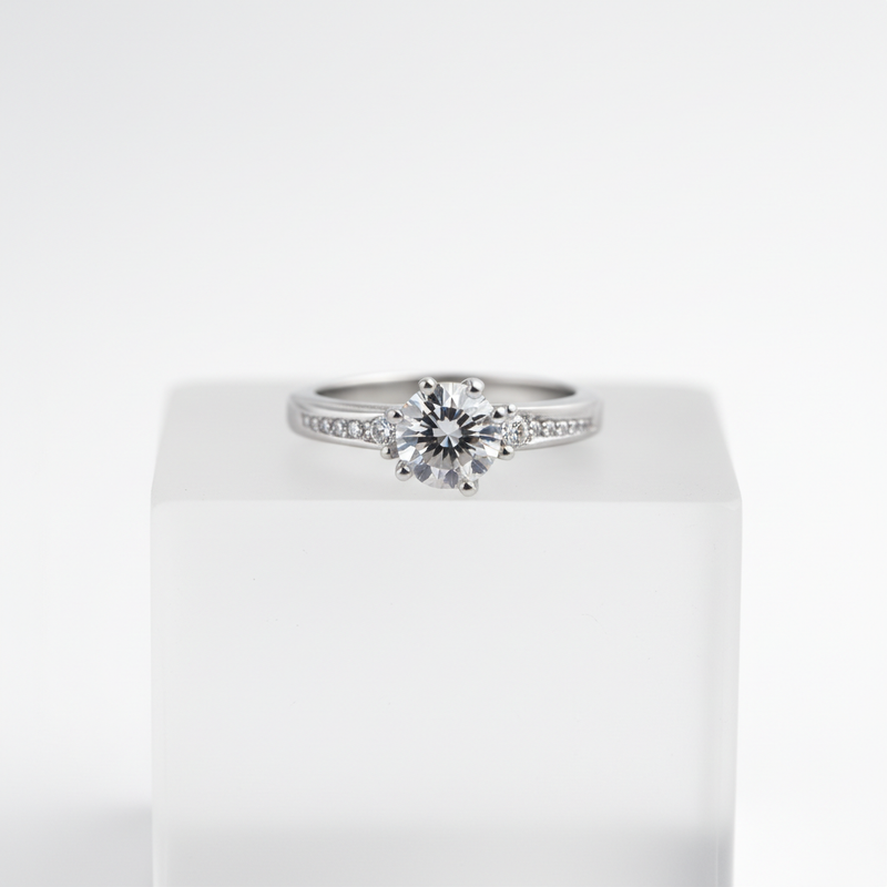 Elegant solitaire ring with sparkling side stones.