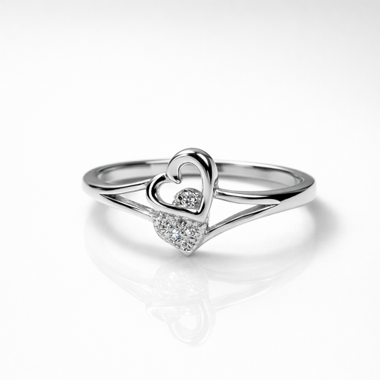 Elegant silver heart ring with sparkling stones, designed to symbolize love and timeless charm